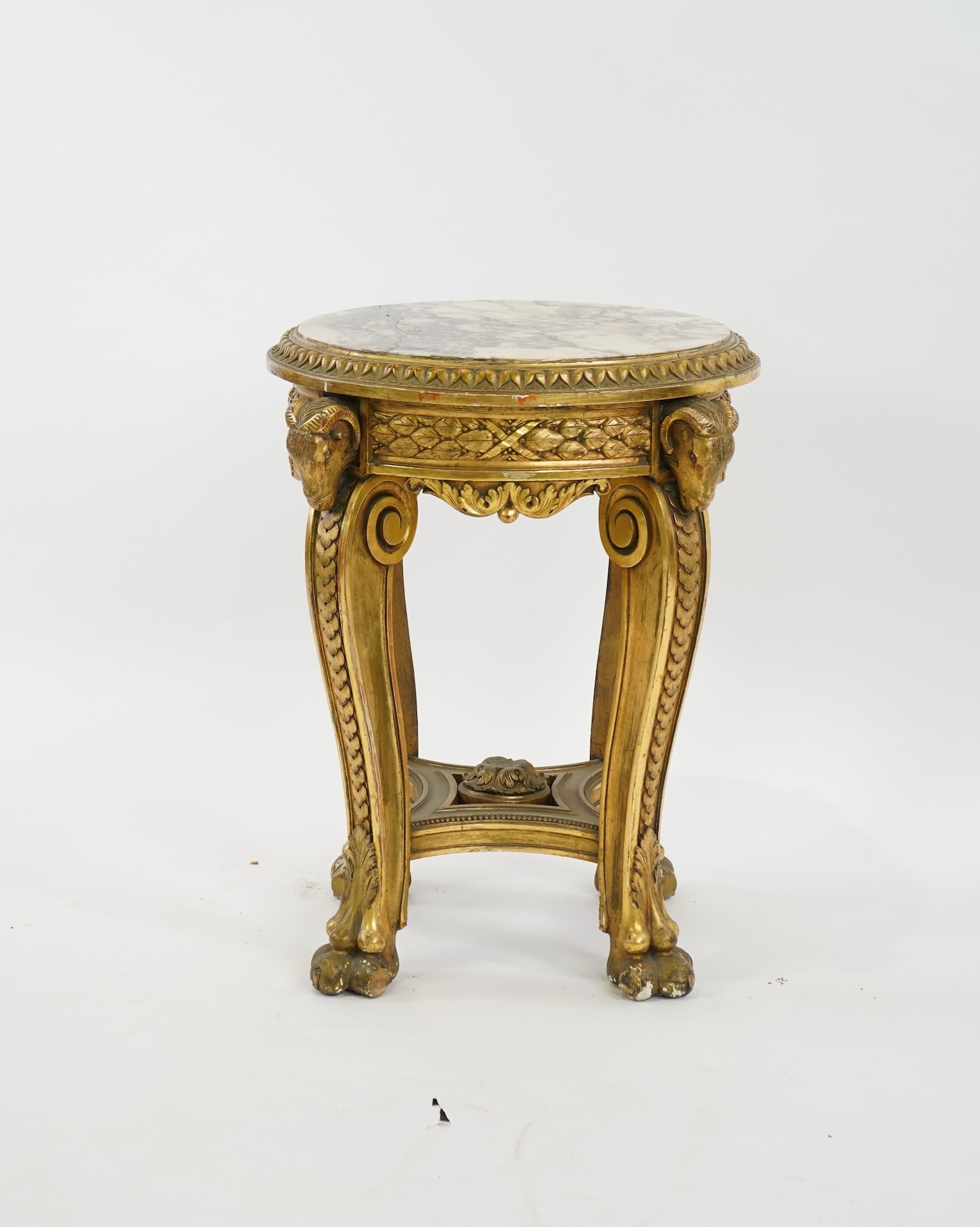A late 19th century French circular carved giltwood and composition vase stand